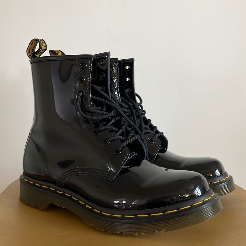 Almost new womens Doc Martens patent black leather 8-eyelet boots.